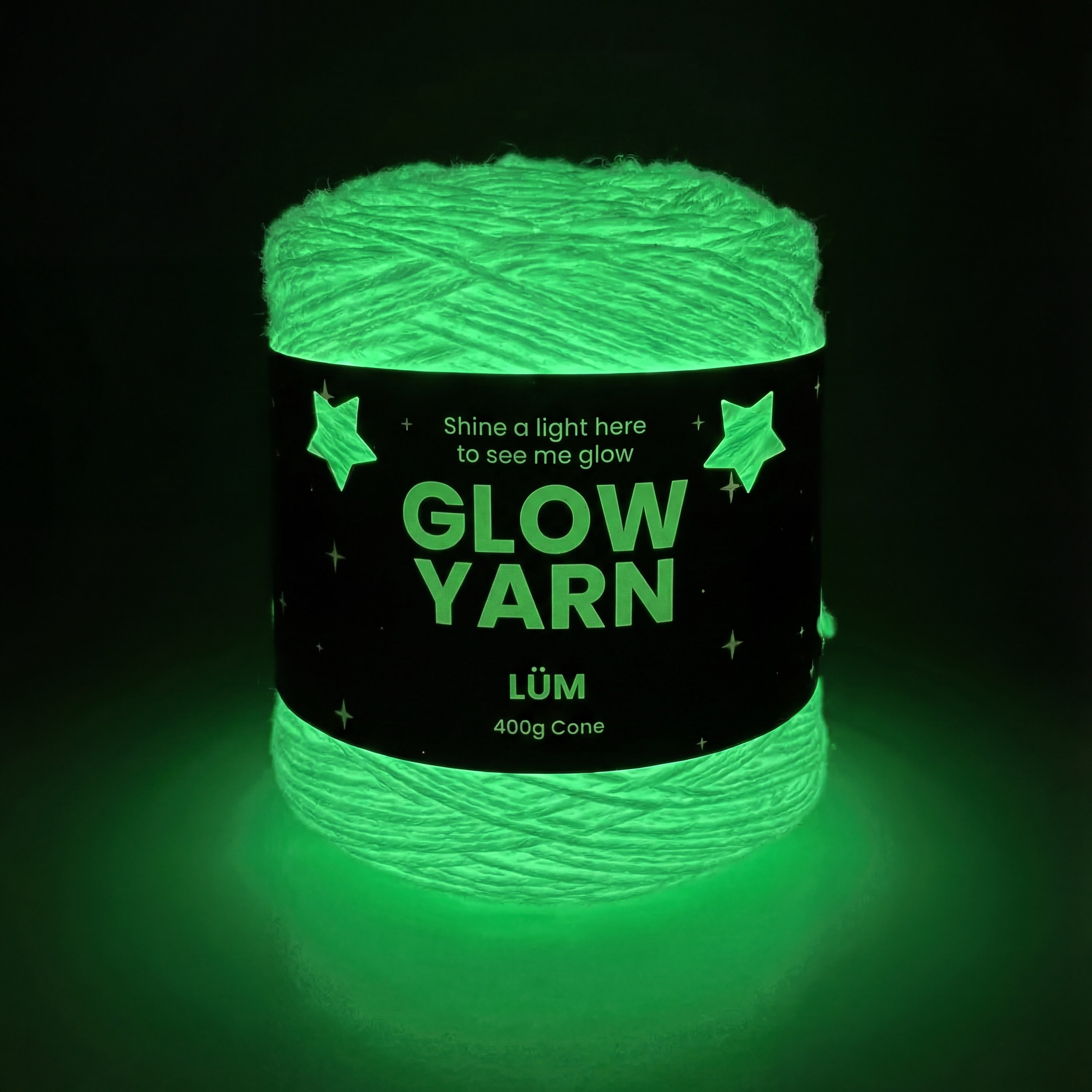 Glowing green yarn with a label on a black background